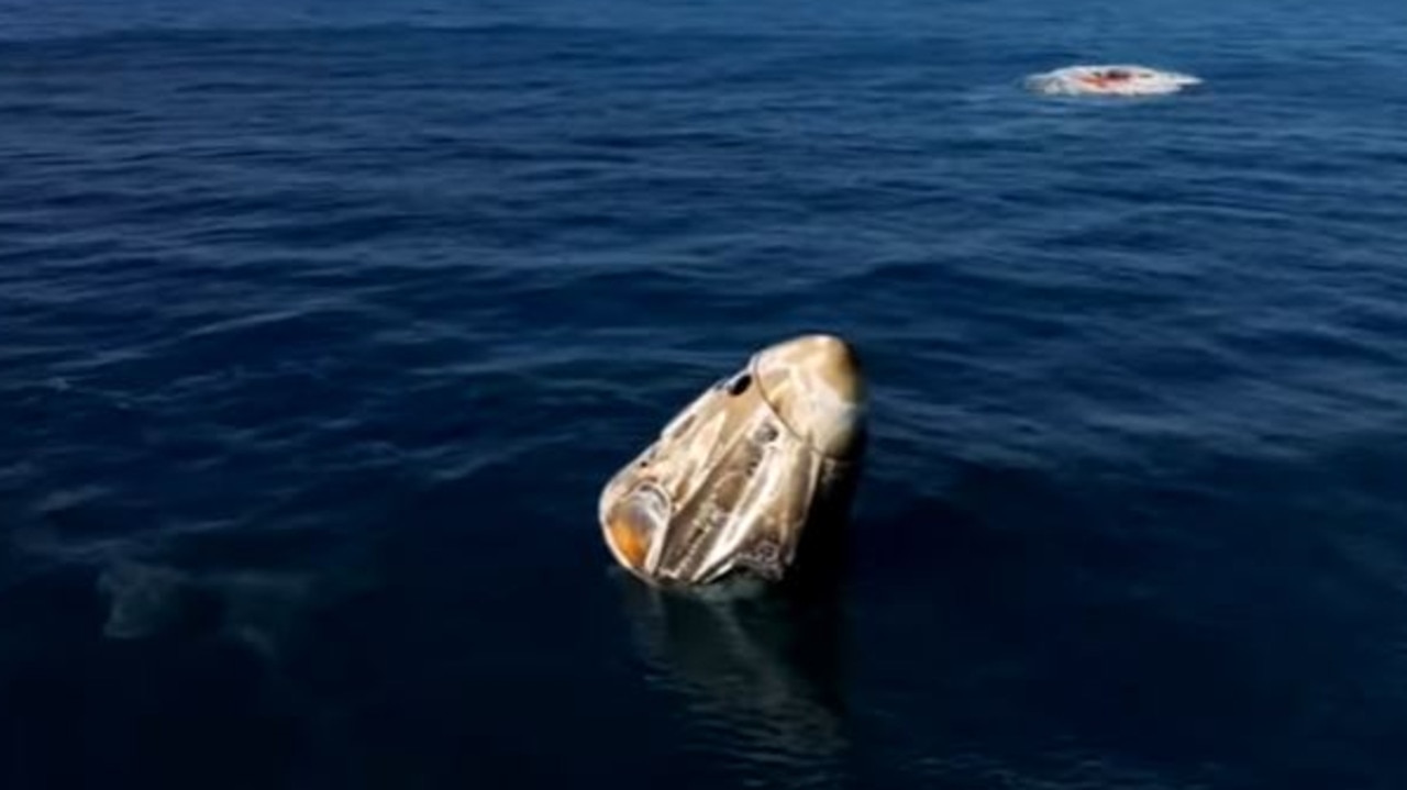 Stranded astronauts finally splash down