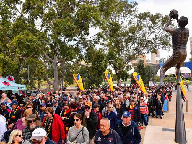 Fans head into Adelaide Oval before the AFLW Grand Final match between the Crows and Carlton. More than 53,000 people attended — far more than expected, putting a huge strain on public transport. Picture: Daniel Kalisz/Getty 