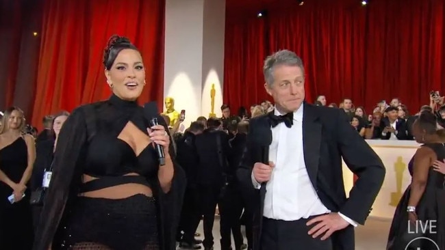 Hugh Grant awkwardly looks away. Pictures: ashleygraham/Instagram, ABC