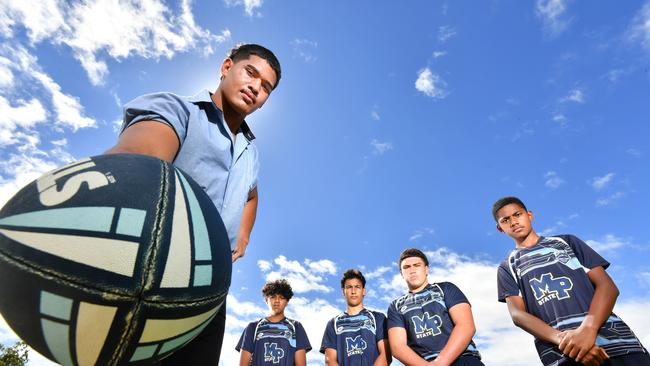 Alex Leapai with young members of the Mabel Park State High School league program. Picture, John Gass