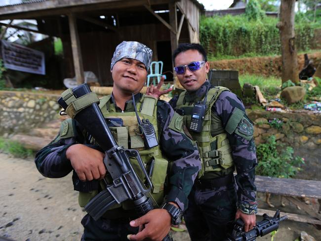 Two soldiers at military checkpoints leading into Marawi. Picture: Gary Ramage