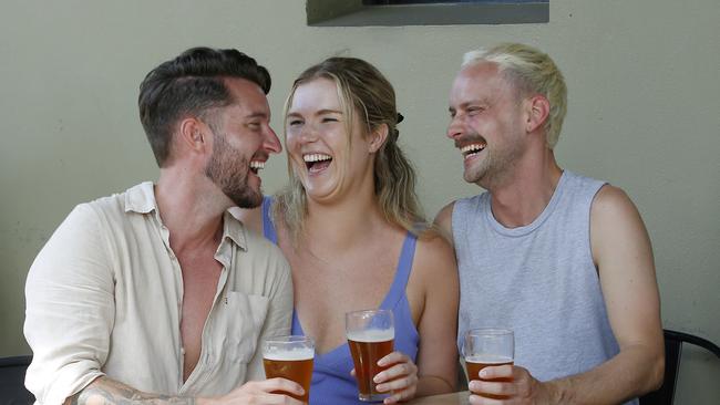 Nathan McInulty, Amelia Daley and Harry Bolton enjoy some beers at the Dove and Olive Hotel in Surry Hills. Picture: John Appleyard