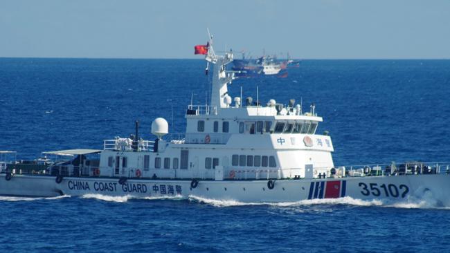 Japan's coast guard spotted the vessels on Saturday along with a fleet of 230 Chinese fishing boats swarming around the Japanese-controlled Senkaku Islands. China also claims the islands, calling them the Diaoyu. Picture: AP.