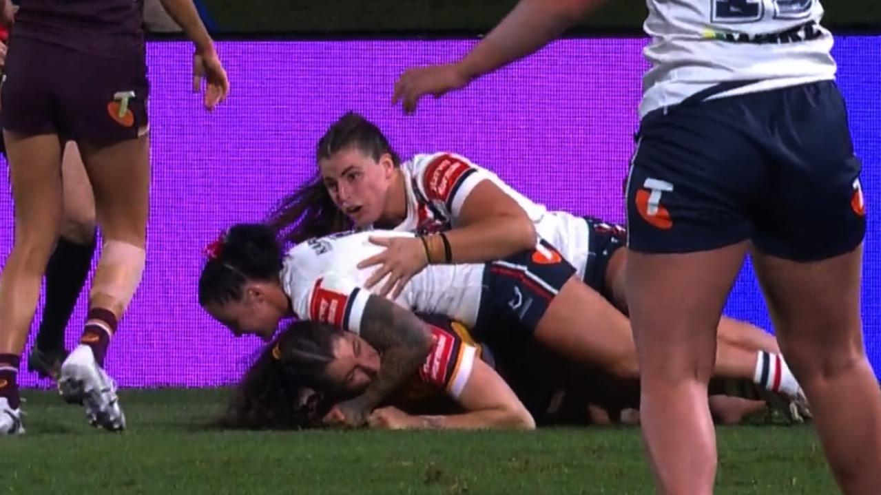 Broncos winger Ashleigh Werner is sent off last night for this alleged bite on her Sydney Roosters opposite Jayme Fressard.