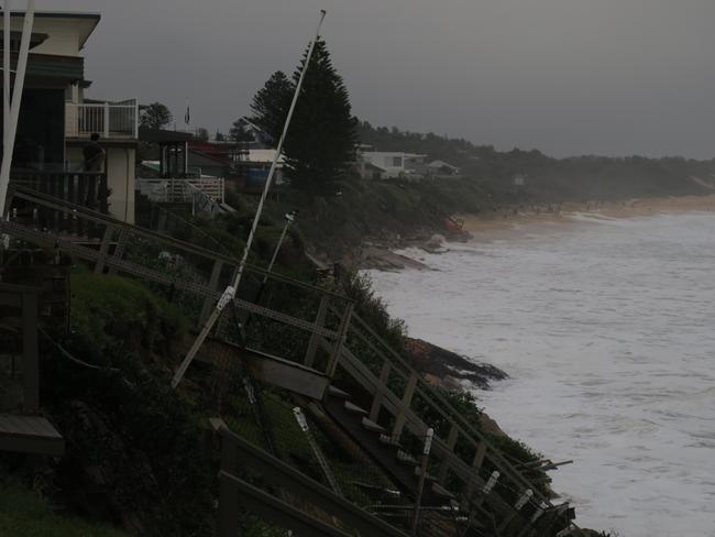 Huge swells have cause massive erosion problems at Wamberal where houses are teetering on the edge. Picture: Richard Noone