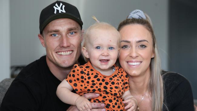 Beau Webster and Becki Munro from Willowvale, with their one year old daughter Cleo Webster.. Picture Glenn Hampson