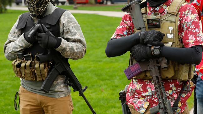 Armed protesters on the steps of the Michigan State Capitol in April. Picture: AFP