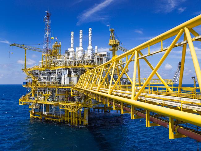 Oil and Gas production platform in blue sky located at the gulf of Thailand.