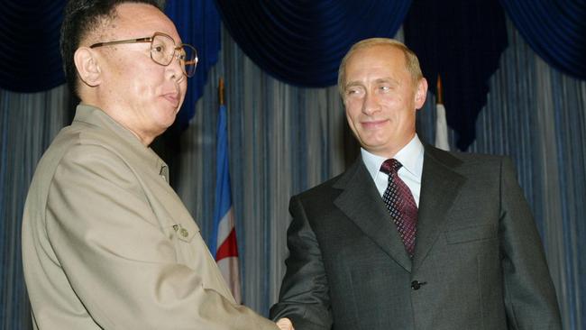 Russian President Vladimir Putin shakes hands with North Korean leader Kim Jong Il during their meeting in Vladivostok, August 2002. AFP PHOTO/ Alexander NEMENOV.