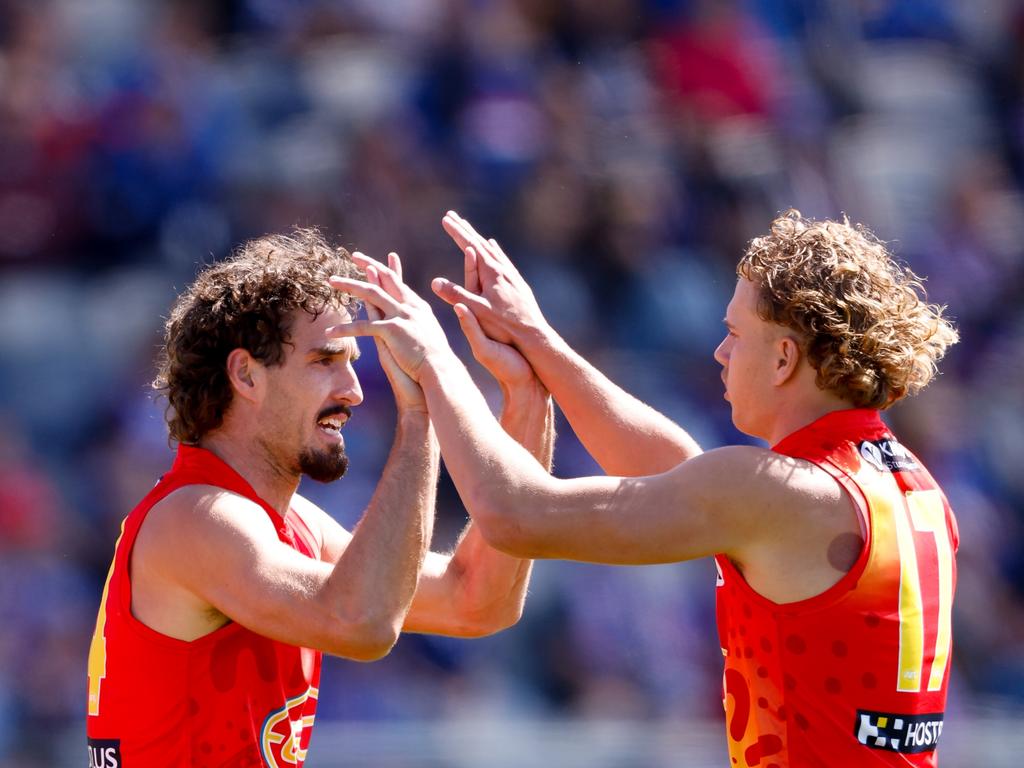 Jed Walter celebrates a goal with Ben King. Picture: Dylan Burns/AFL Photos via Getty Images