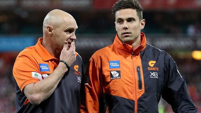 Injured Giants star Josh Kelly leaves the field against Sydney.