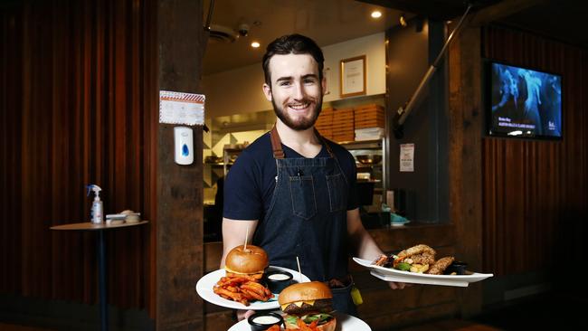 Cairns City leaders want to increase the population density of the CBD, creating an area where Cairns residents live, work and play. Pier Bar supervisor Reilly Davis lives and works in the CBD. PICTURE: BRENDAN RADKE