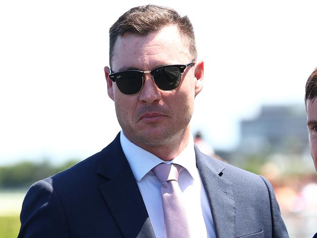 SYDNEY, AUSTRALIA - DECEMBER 23: Trainer Nathan Doyle celebrates after Chad Schofield riding Cripps Tonite wins Race 4 Midway during Sydney Racing at Royal Randwick Racecourse on December 23, 2023 in Sydney, Australia. (Photo by Jeremy Ng/Getty Images)