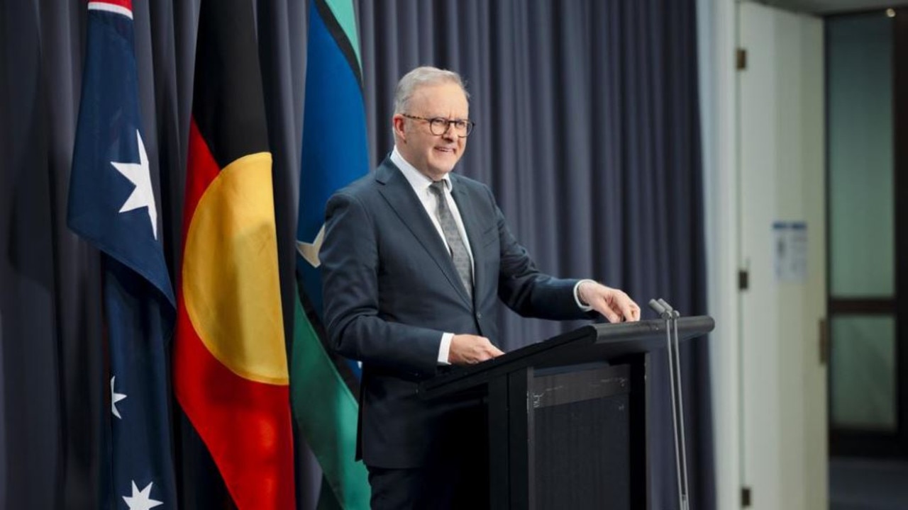 Prime Minister Anthony Albanese in font of the three flags at a press conference in Canberra. Picture: NewsWire / David Beach