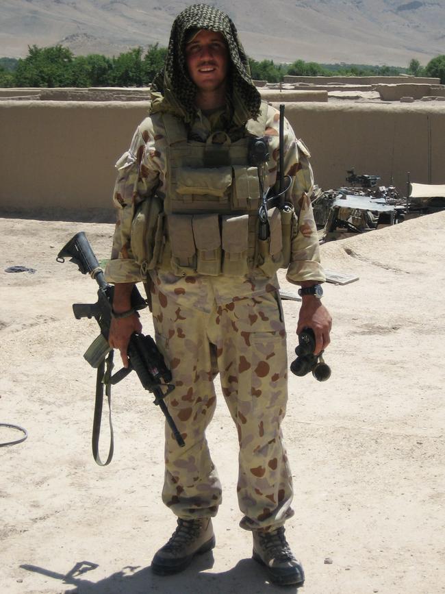 Combat medic Brad Watts fully kitted up to go on patrol in Afghanistan