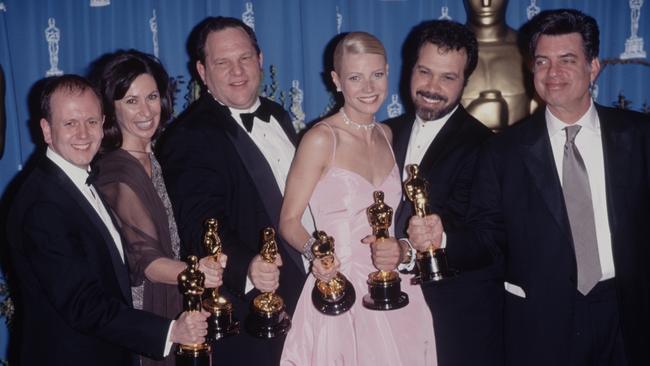 Left to right, David Parfitt, Donna Gigliotti, Harvey Weinstein, Gwyneth Paltrow, Edward Zwick, and Marc Norman at the 71st Academy Awards in 1999 where Paltrow won the best actress award.