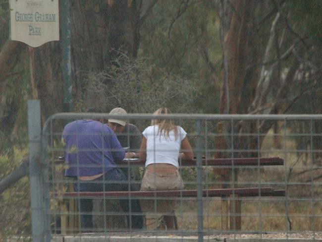 Pasquale Barbaro, Rob Karam and Sharon Ropa thought they were safe to chat at a Shepparton park, but AFP operatives were listening and watching. Picture: Australian Federal Police.