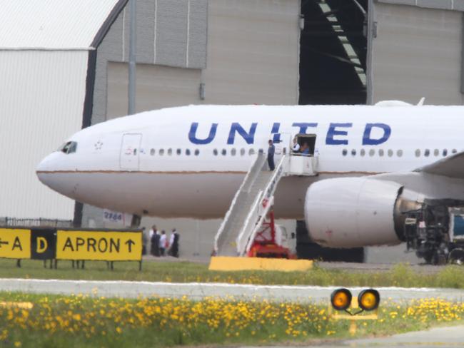 An United Airlines plane took off from San Francisco bound for Sydney but was diverted to Canberra. 300 passengers and crew were trapped on the plane from 9am as United Airlines would not foot the bill for Australian Customs officers to travel out to the aircraft to clear the passengers. The passengers had no food, water or toilet facilities since 9am. Pictured is what looks like passengers leaving the plane.