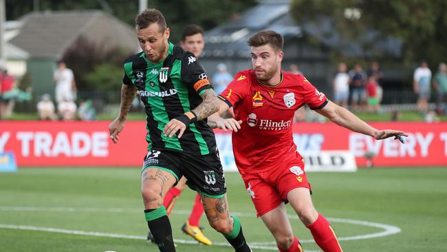 Western United’s Alessandro Diamanti and Adelaide United’s Ryan Strain during the Reds 4-3 win at Whitten Oval in January. (AAP Image/George Salpigtidis)