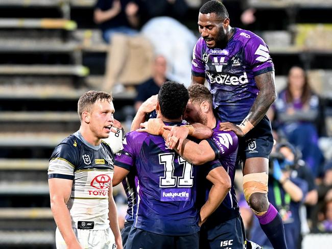 SUNSHINE COAST, AUSTRALIA - SEPTEMBER 13: Jahrome Hughes of the Storm is congratulated by team mates after scoring a try during the round 18 NRL match between the Melbourne Storm and the North Queensland Cowboys at [VEUNE] on September 13, 2020 in Sunshine Coast, Australia. (Photo by Bradley Kanaris/Getty Images)