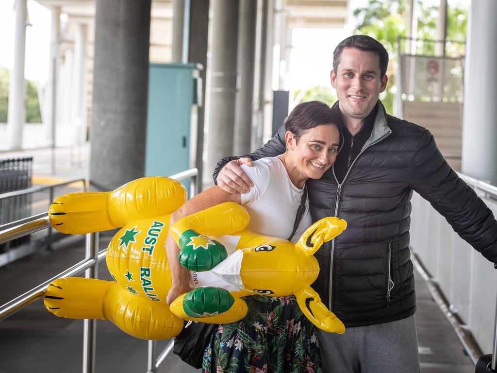 Audine Bartlett hugs brother Grant Bartlett at Brisbane International airport as borders re-open. Picture: Brad Fleet