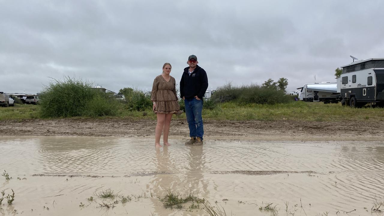 Abbie and Ben said their swag weathered the rain and are ready to hit the pub. Picture: Vanessa Brown/news.com.au