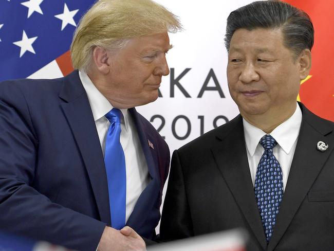 US President Donald Trump, left, and Chinese President Xi Jinping’s trade war is hurting confidence in the market. Picture: AP