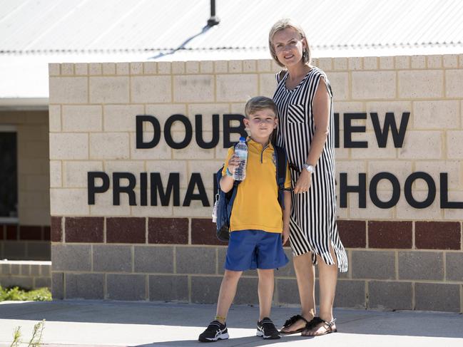 Elmarie Dupreez with her son Miller (7), who attends Doubleview Primary School.   The result from Doubleview's lead levels have yet to be released, and as a precaution bottled water has been given to students.Elevated lead levels have been discovered in water at five primary schools in Western Australia, amid a similar scare at the yet-to-be opened Perth Children’s Hospital. On the first day of the school year, Education Minister Sue Ellery insisted there was no risk to students, saying none of the taps where the elevated lead levels were discovered were used to provide drinking water. But she said bottled water would be given to students as a precaution.