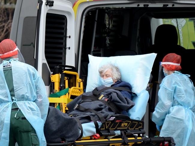 MELBOURNE, AUSTRALIA - NewsWire Photos JULY 28: Ambulance staff transport residents from Epping Gardens Aged Care to hospital. Picture: NCA NewsWire / Andrew Henshaw