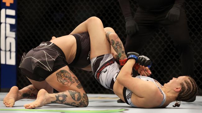 Julija Stoliarenko (R) of Lithuania submits Jessica-Rose Clark of Australia in the first round of their bantamweight bout during UFC 276. Picture: AFP.