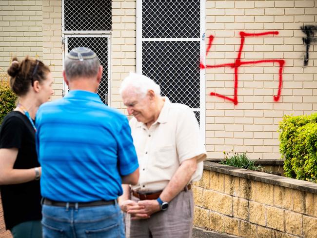 Synagogue President George Foster with members of the community outside the vandalised synagogue. Picture: Tom Parrish