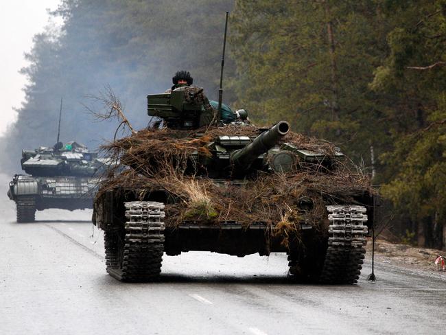 Ukrainian tanks move on a road before an attack in Lugansk region. Picture: Anatolii Stepanov / AFP