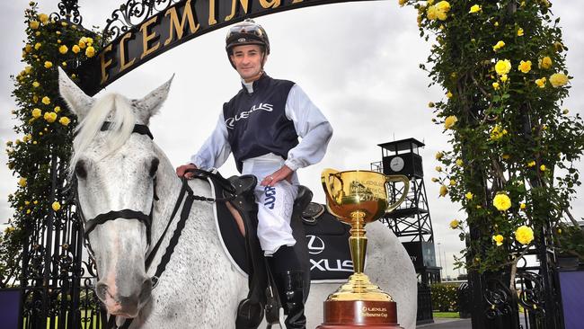 Melbourne Cup winning jockey Corey Brown on a horse in the Flemington archways. Brown, who was on board Rekindling to win last year's Cup, will be a new Lexus ambassador. PictureTony Gough