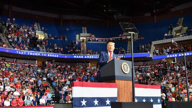 The upper section is seen partially empty as US President Donald Trump speaks during a campaign rally at the BOK Centre in Tulsa, Oklahoma.