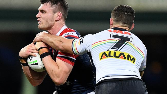 Angus Crichton of the Roosters is tackled by Nathan Cleary of the Panthers during the Round 24 NRL match between the Sydney Roosters and the Penrith Panthers at the SCG in Sydney, Saturday, August 31, 2019. (AAP Image/Dan Himbrechts) NO ARCHIVING, EDITORIAL USE ONLY