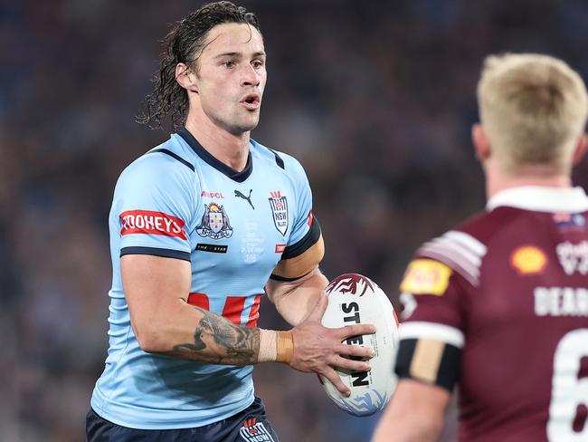 SYDNEY, AUSTRALIA - JUNE 05:  Nicho Hynes of the Blues runs the ball during game one of the 2024 Men's State of Origin Series between New South Wales Blues and Queensland Maroons at Accor Stadium on June 05, 2024 in Sydney, Australia. (Photo by Cameron Spencer/Getty Images)