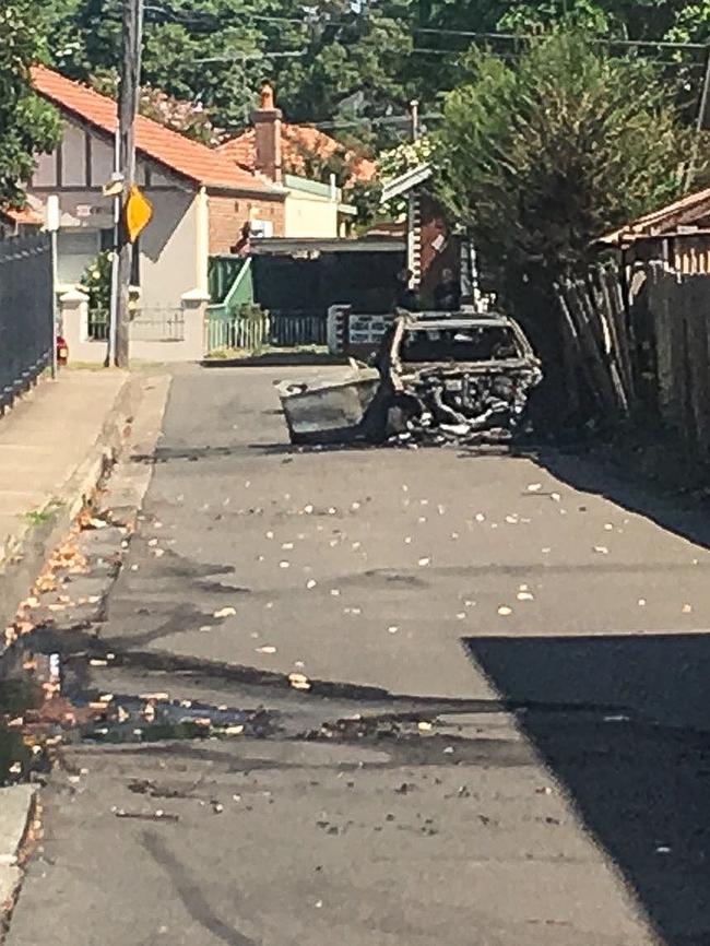 A burned out car believed to be involved in Mick Hawi’s murder. Picture: Nick Hansen