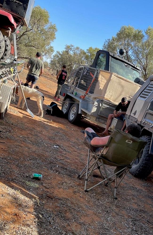 Queensland police continue to investigate the suspicious disappearance of 27-year-old Jeremiah Rivers. This is the last picture of him, taken at a pig hunting camp before he disappeared. He is in the centre of the image wearing a black basketball shirt.