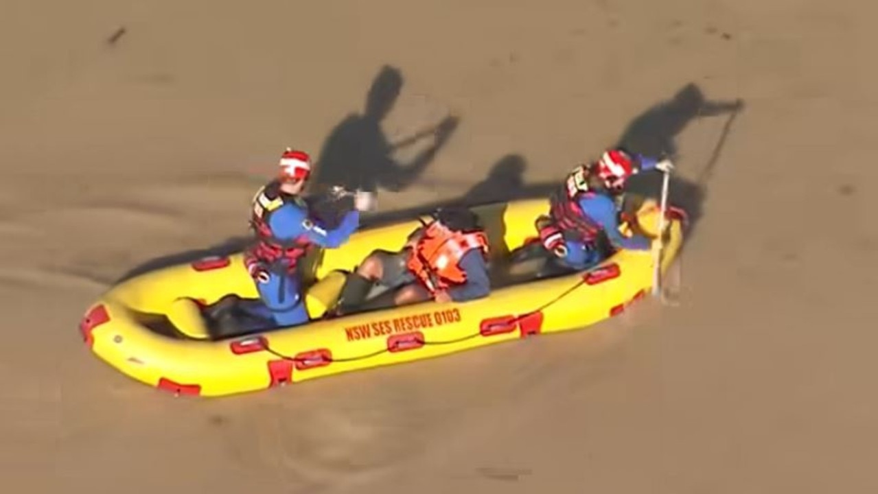 The man was escorted back to shore safely by SES volunteers. Picture: 9NEWS