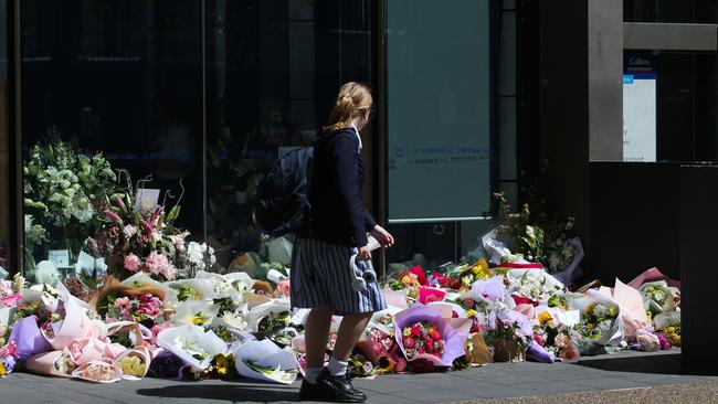 Floral tributes to Ms James left at St Andrews, where it has been announced the toilet block, in which her body was found, will be torn down. Photo by: NCA Newswire /Gaye Gerard