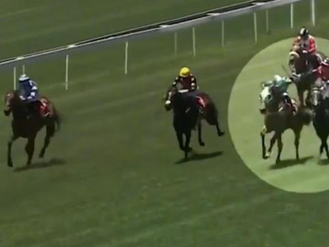 Furious jockey whips rival!