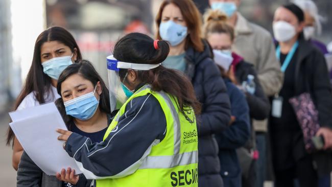 Aged care and disability care workers lining up for their vaccine at the Melbourne Showgrounds. Picture: Ian Currie