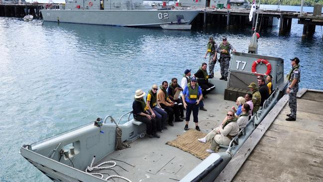 Manus Island Regional Processing Centre (MIRPC) staff board a Naval Landing Craft Vehicle, Personnel (LCVP) for transfer. Photo Supplied.