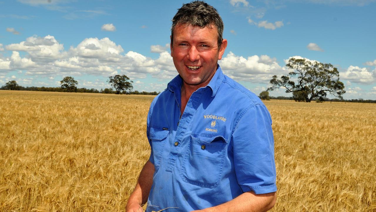 Farmer Brett Hosking in a barley crop on his property at Oakvale, in northern Victoria. Picture: James Wagstaff