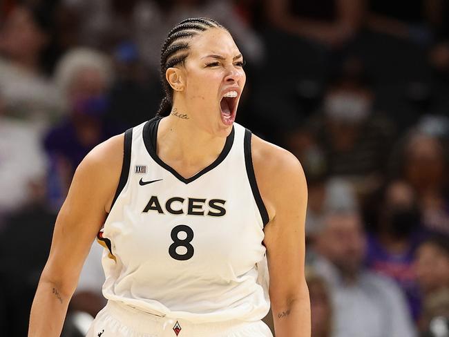 PHOENIX, ARIZONA - OCTOBER 06: Liz Cambage #8 of the Las Vegas Aces celebrates after a three-point shot against the Phoenix Mercury during the second half in Game Four of the 2021 WNBA semifinals at Footprint Center on October 06, 2021 in Phoenix, Arizona. The Aces defeated the Mercury 93-76. NOTE TO USER: User expressly acknowledges and agrees that, by downloading and or using this photograph, User is consenting to the terms and conditions of the Getty Images License Agreement.   Christian Petersen/Getty Images/AFP == FOR NEWSPAPERS, INTERNET, TELCOS & TELEVISION USE ONLY ==