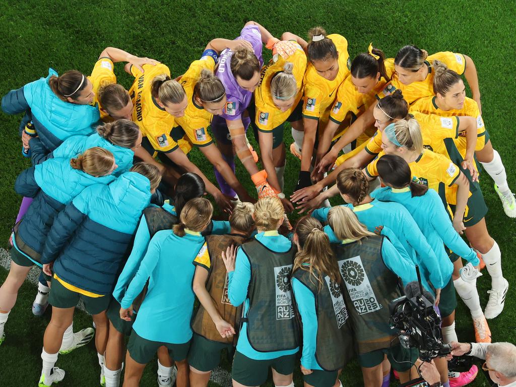 Team work makes the dream work: Australian players united in a huddle before they take on Denmark in Sydney. Picture: Robert Cianflone/Getty Images