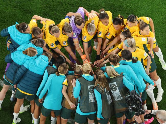 Team work makes the dream work: Australian players united in a huddle before they take on Denmark in Sydney. Picture: Robert Cianflone/Getty Images
