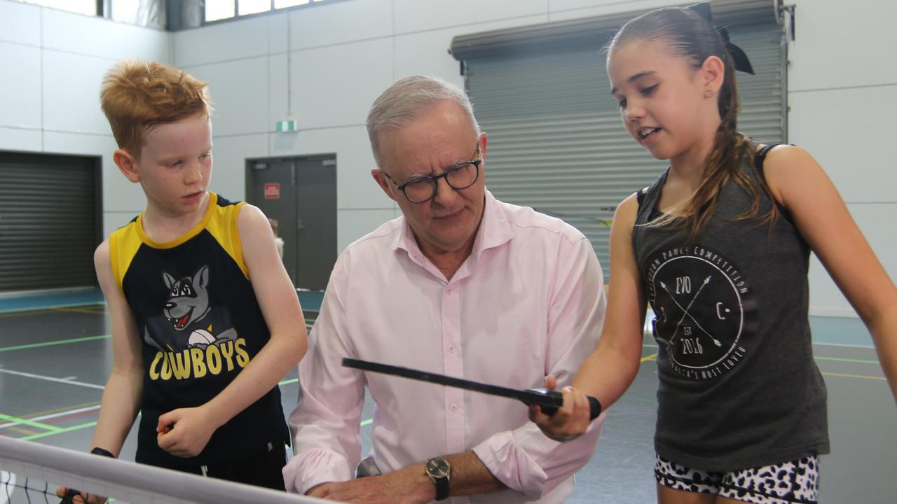 Redlynch siblings Connor Lucht, 7 and Milla Lucht, 11, discuss pickleball techniques with the Prime Minister. Picture: Samuel Davis