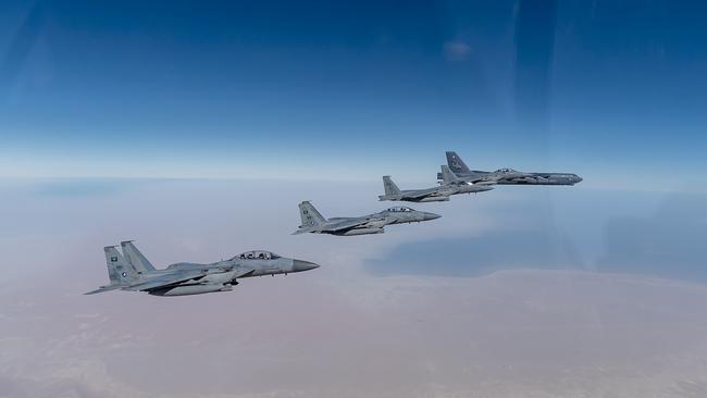 A US Air Force B-52 Stratofortress flies with Royal Saudi Arabian Air Force F-15SAs during a bomber task force mission. Picture: AFP