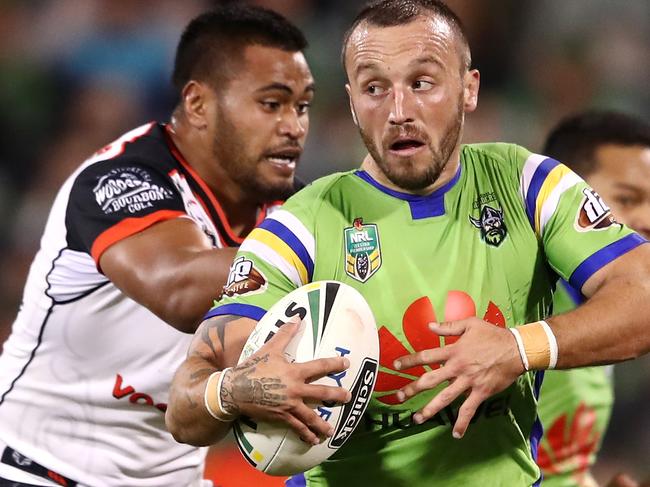 CANBERRA, AUSTRALIA - APRIL 15: Josh Hodgson of the Raiders is tackled during the round seven NRL match between the Canberra Raiders and the New Zealand Warriors at GIO Stadium on April 15, 2017 in Canberra, Australia.  (Photo by Cameron Spencer/Getty Images)